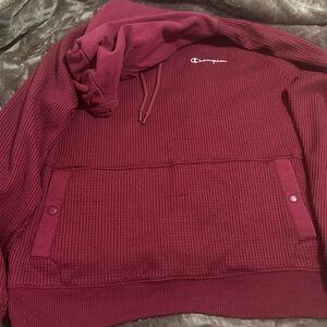 This is a burgundy Champion hoodie with a waffle texture. L Good condition